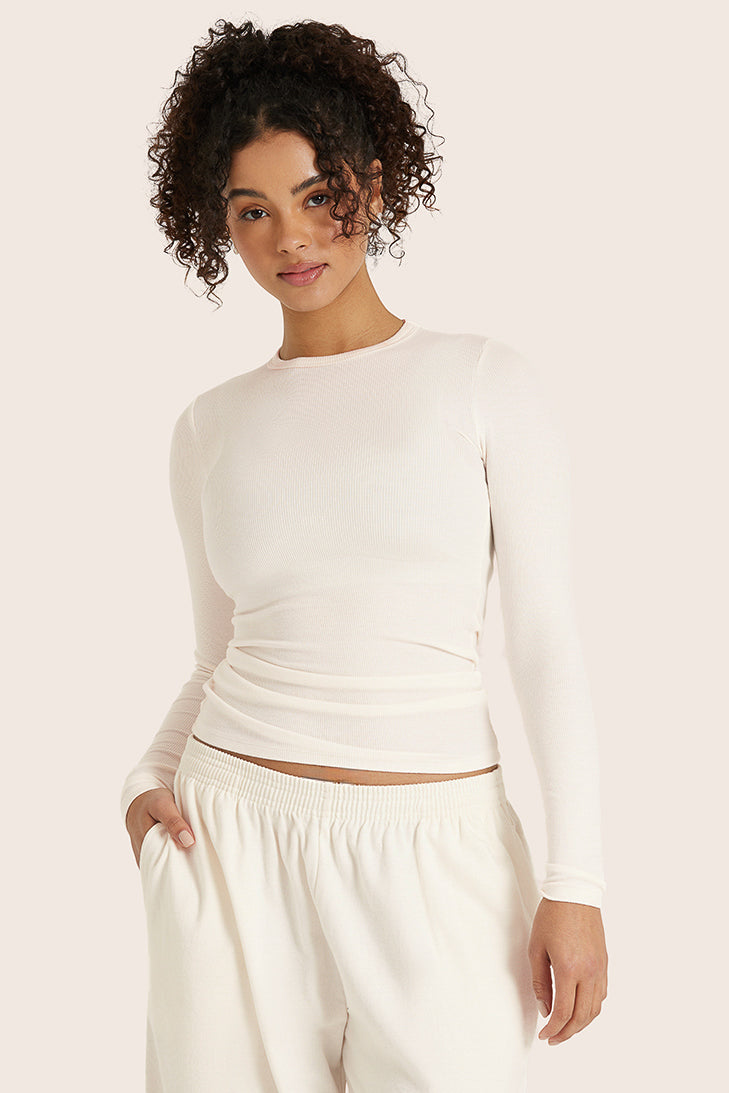 MODEL WEARS RIBBED MODAL BODY LONG SLEEVE IN BLANC