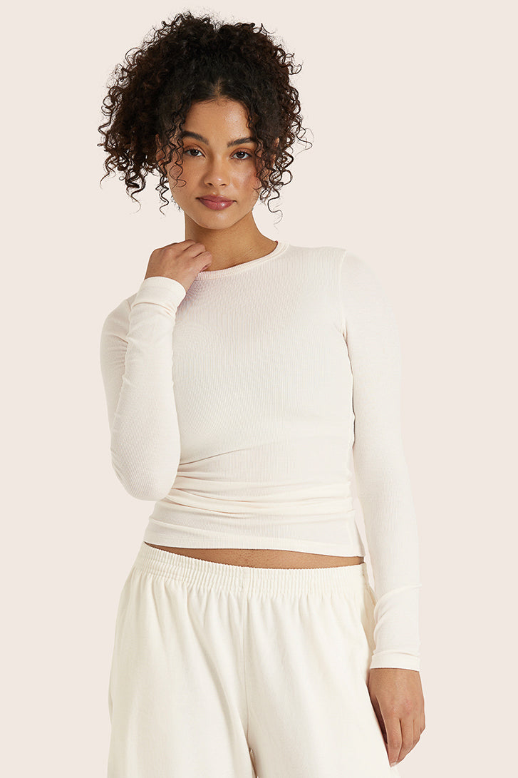 MODEL WEARS RIBBED MODAL BODY LONG SLEEVE IN BLANC