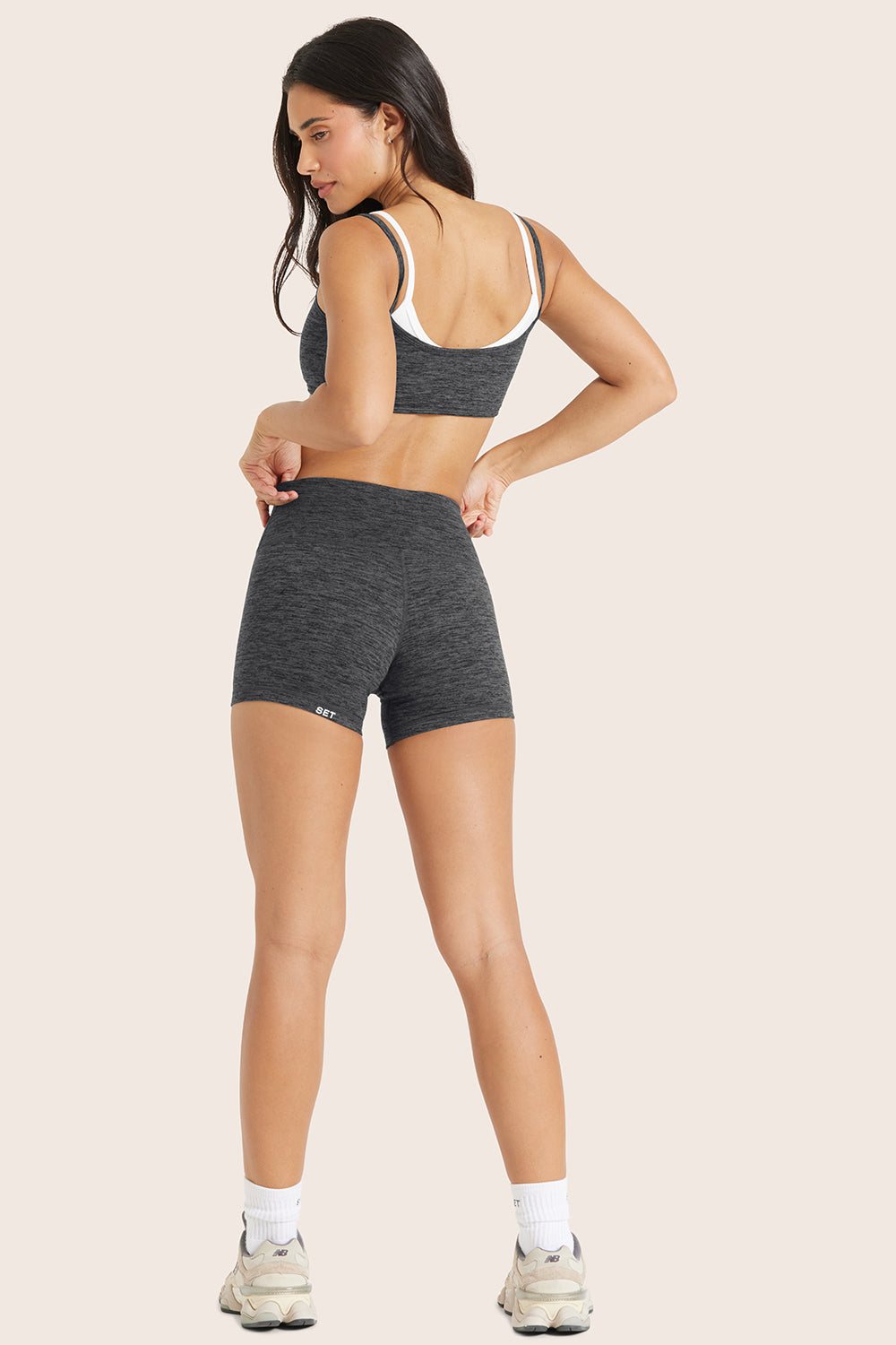 MODEL WEARS FORMCLOUD® BIKE SHORTS IN PEPPER HEATHER GREY