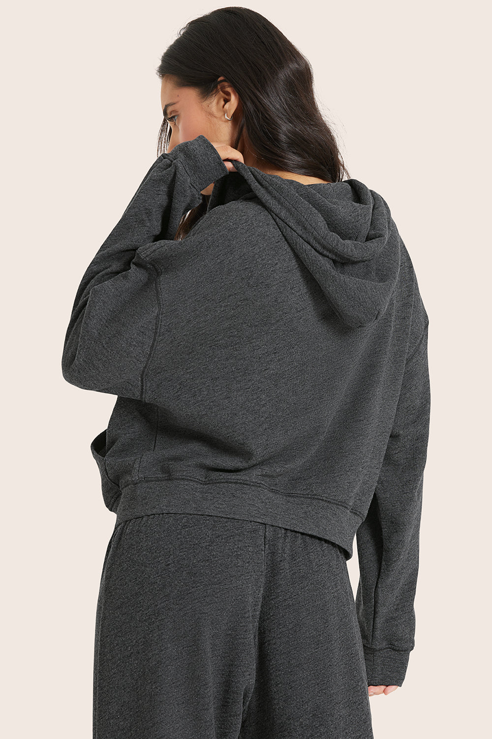 MODEL WEARS LIGHTWEIGHT SWEATS CLASSIC ZIP HOODIE IN PEPPER HEATHER GREY