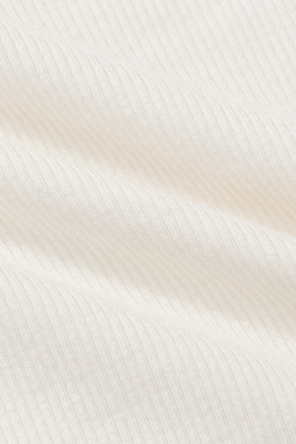 CLOSE UP IMAGE OF RIBBED MODAL FABRIC IN BLANC