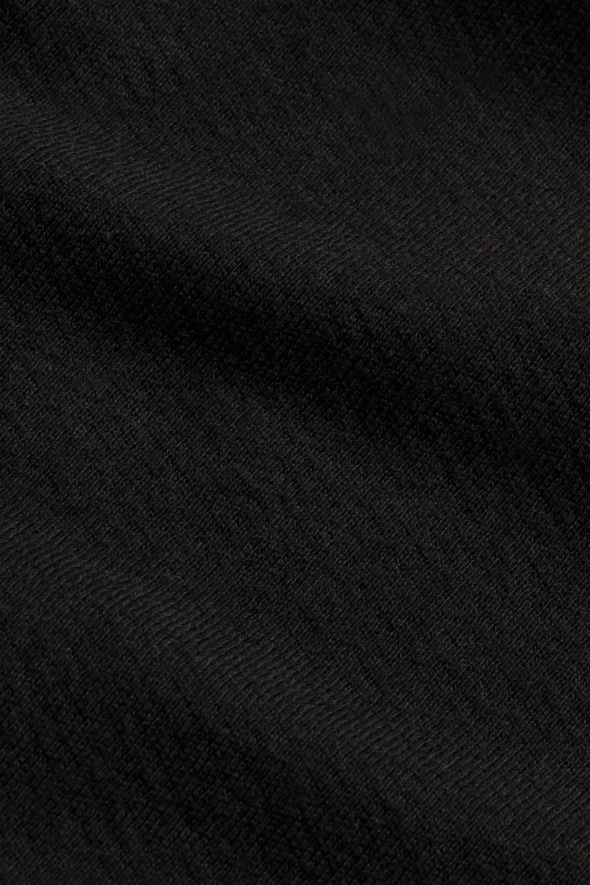 CLOSE UP IMAGE OF LIGHTWEIGHT SWEATS FABRIC IN ONYX