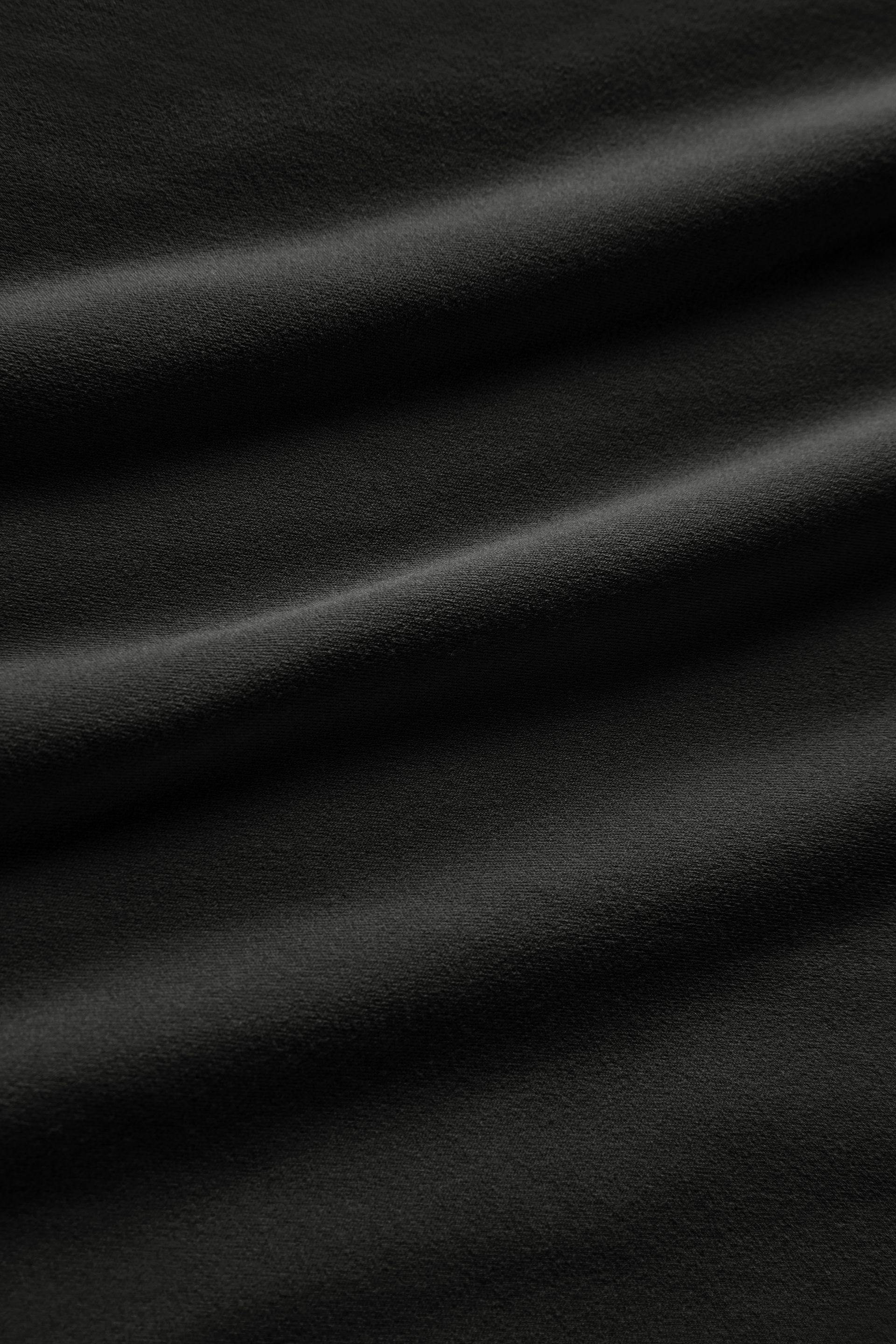 CLOSE UP IMAGE OF AIRLUXE™ FABRIC IN ONYX