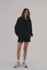 MODEL WEARS SET™ LIGHTWEIGHT SWEATS CLASSIC HOODIE IN ONYX