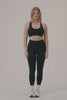 MODEL WEARS SCULPTFLEX® POWER HIGH-RISE LEGGINGS IN ONYX