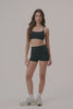 MODEL WEARS AIRLUXE™ BREATHE MINI SHORTS IN ONYX